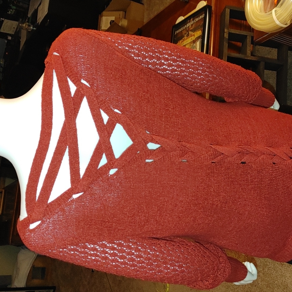 Burnt orange sweater with crisscross back. Great condition. Lightly used.